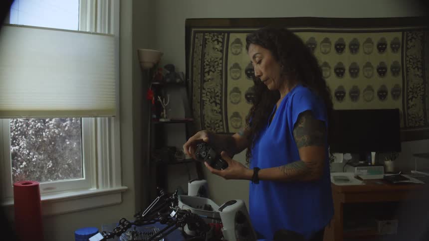 Woman putting a camera inside a water housing