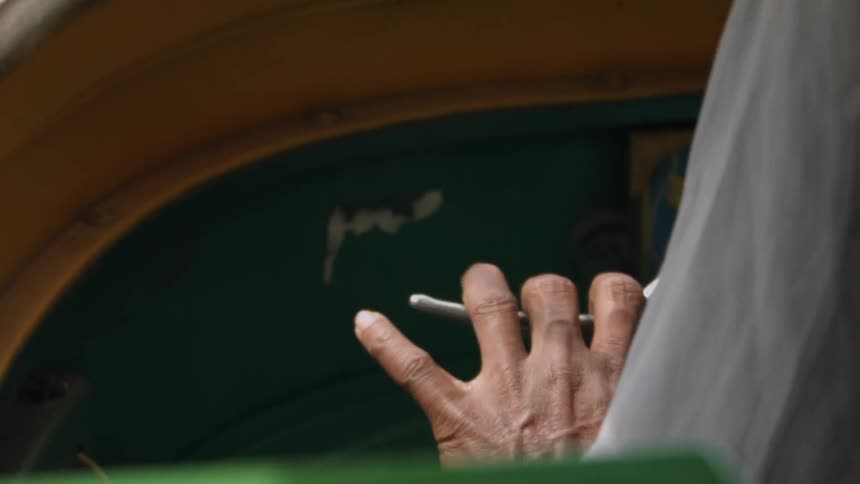 A man is pressing the lever in a vehicle