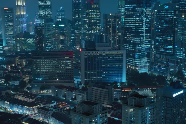 Apartments lights of buildings in a metropolitan area going on and off at night