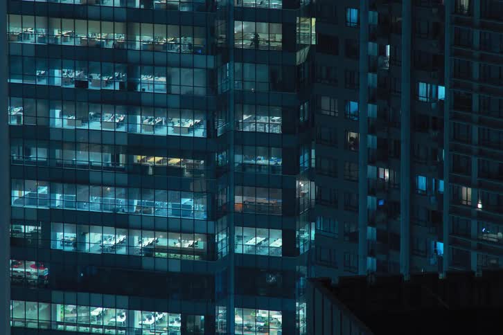 Timelapse of buildings in a metropolis at night