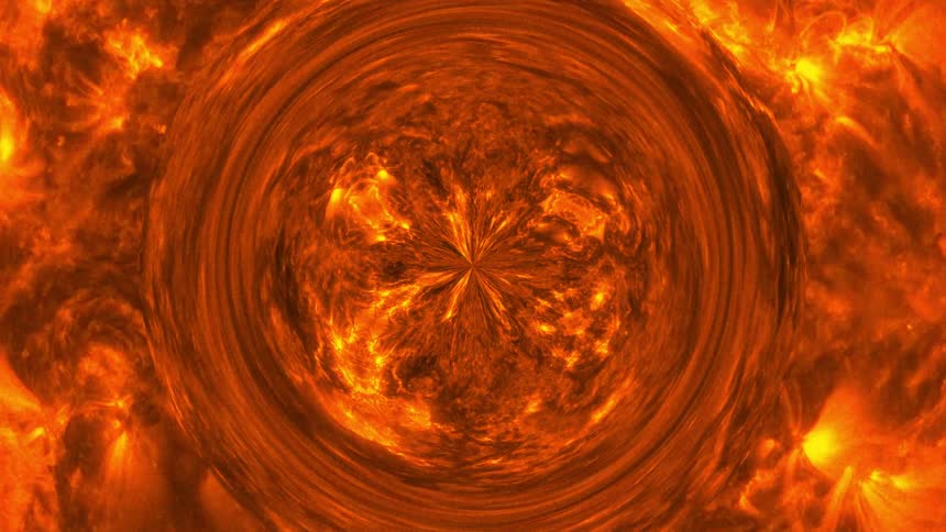 The suns surface is a swirling mass of plasma with magnetic field lines