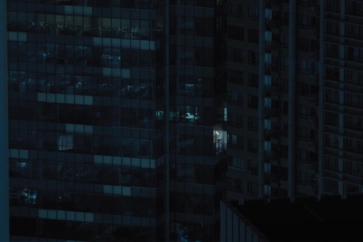 Time lapse of lights going off in the city at night