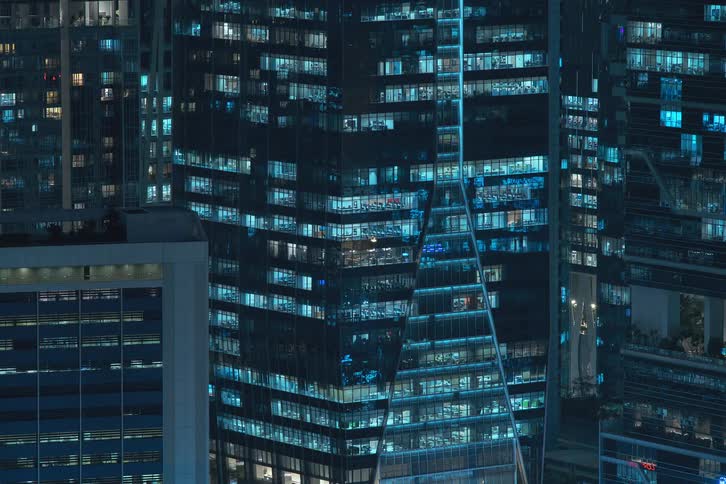 A clip of apartments lights in the metropolis turn on together
