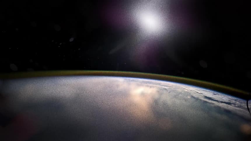 Aerial panorama of earth from space with a luminous celestial body above