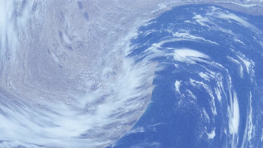 A distortion effect is stretching and pulling different areas of a high altitude image of the surface of the earth