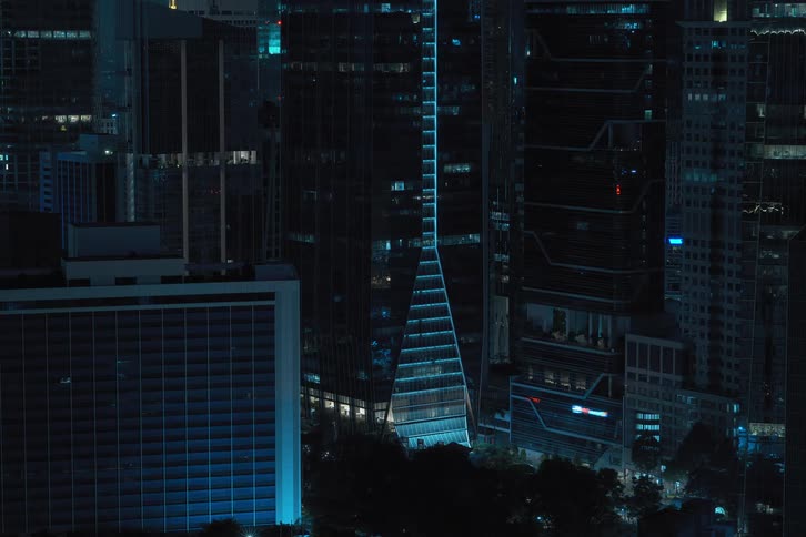 Timelapse of commercial & business skyscrapers with building lights turning off at night