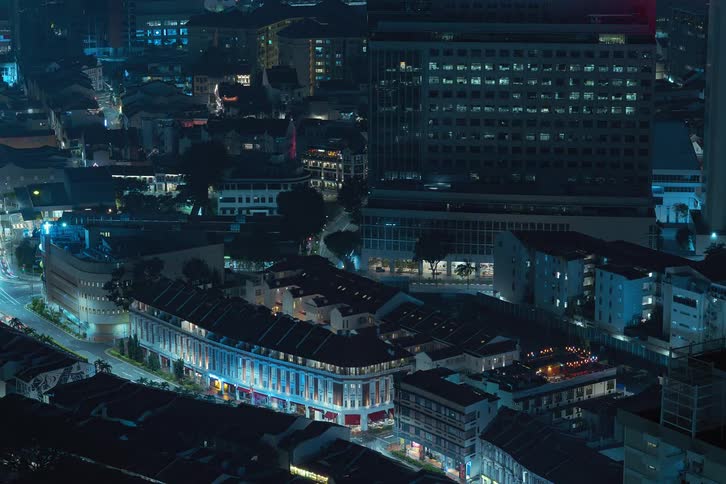 View of a metropolis with buildings and intersections at night in time lapse