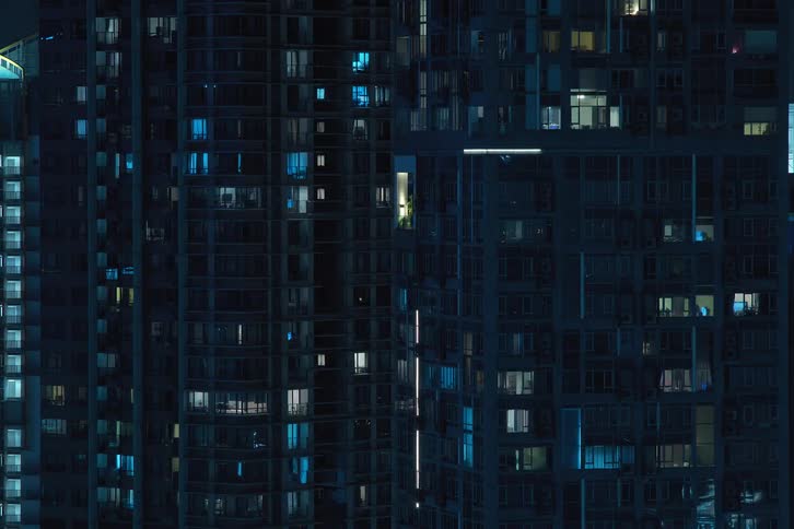 City buildings illuminated during the dark night