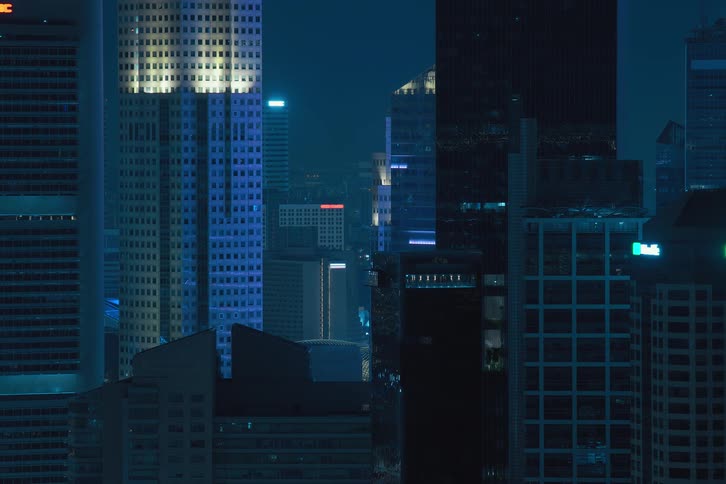 The lights of the citys urban buildings turn off simultaneously