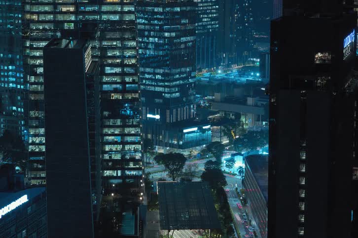 View of buildings and streets in a metropolis at night in time lapse