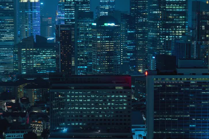 Time lapse of lights going on and off in the city at night