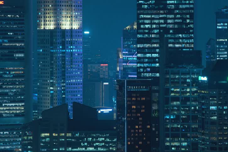 A fast footage of skyscrapers blinking and flashing at night