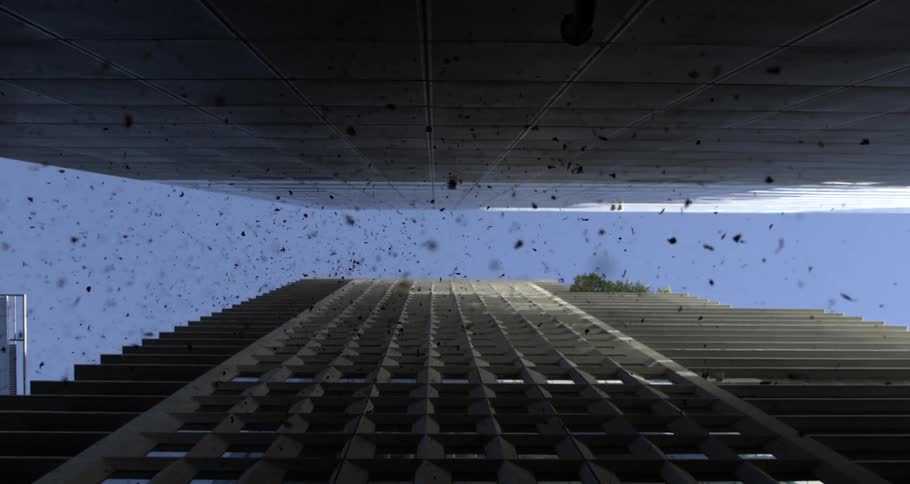 Debris flying between buildings in the city