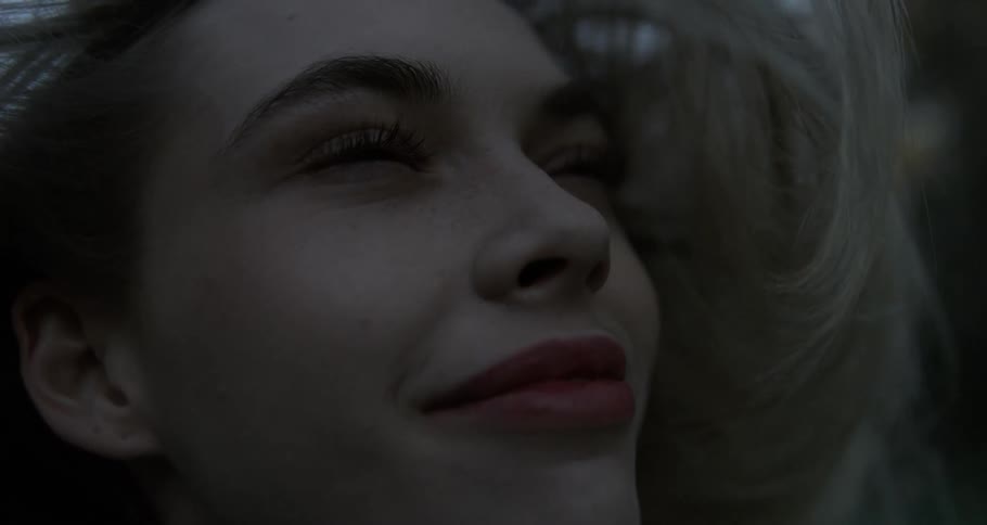 A close up clip of a blond smiling