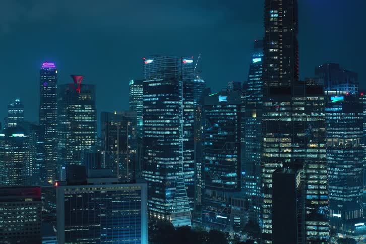 View of a metropolis at night with lights turning on and off in time lapse