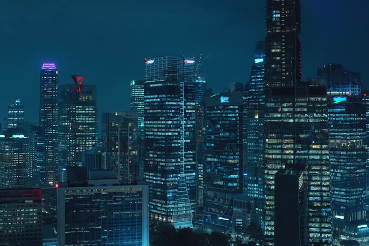 Aerial panorama of skyscrapers at night in time lapse