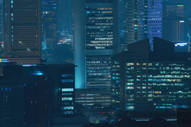Metropolitan city commercial buildings illuminated at night