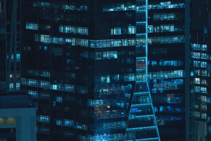 View of buildings in a metropolis at night in time lapse with pulsing flashing and blinking lights