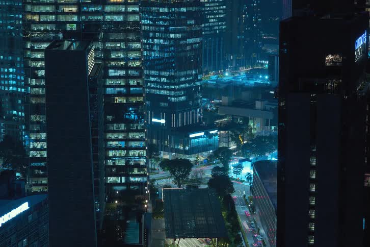 View of a metropolis at night in time lapse with lights and cars passing by