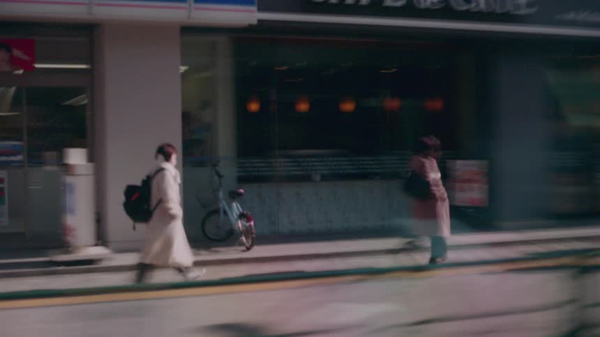 People walking on the sidewalk in a city