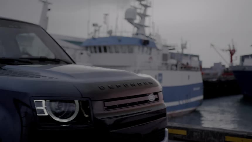 A car stops by the harbor