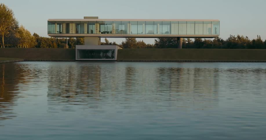 A mansion is set on the shore of the lake