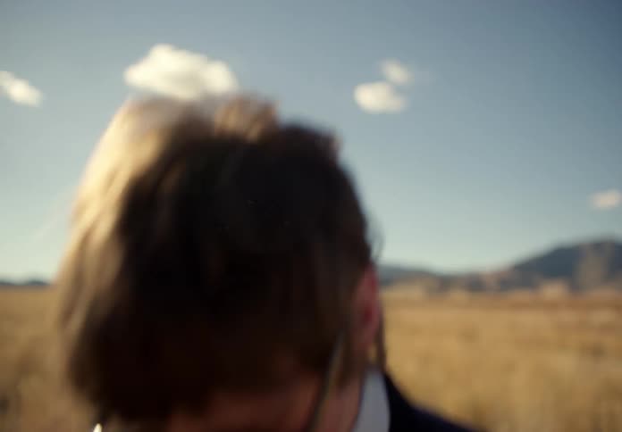 A man in the desert testing a special pair of sunglasses