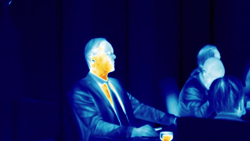 Heat vision of a man attending a meeting at the office