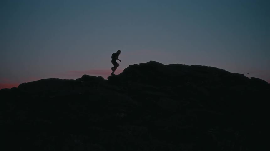 A man is running up the mountain top