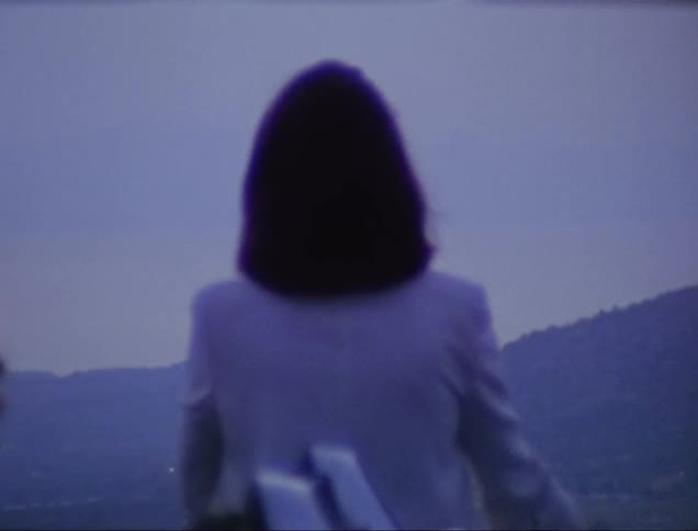 Woman smoking outdoors caught on vintage film