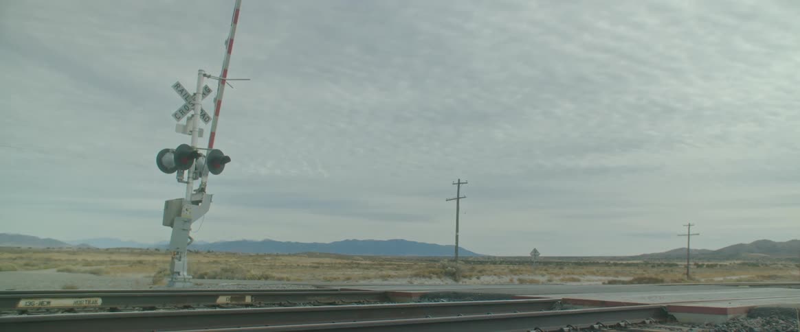 A train track in a rural landscape during the day