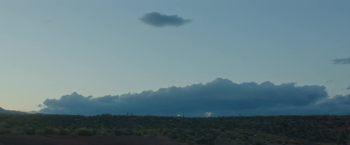 Landscape of a terrain with lush vegetation and the morning sky with clouds