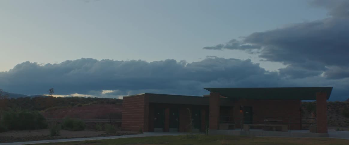 A building in a rural area at sunset
