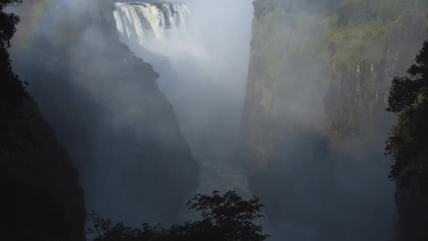 The waterfall is pouring off the cliff