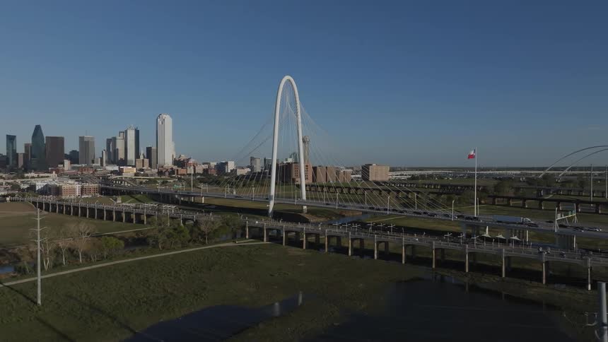 Panoramic view of downtown area and a highway bridge across a small river