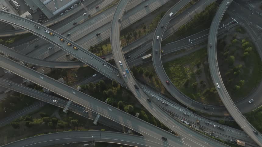 Aerial of traffic flowing along multilayer controlled access highways