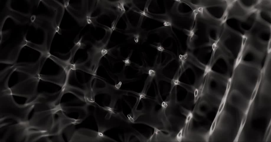 A dark liquid is vibrated which causes different patterns in the surface