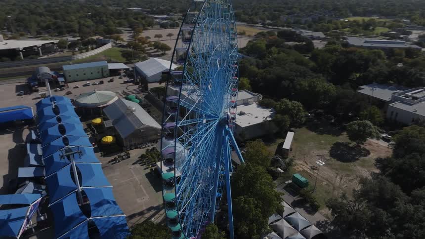 Landscape of texas blue ferris wheel at midday