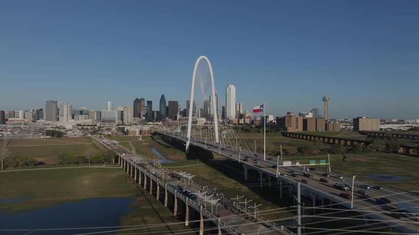 Aerial view of a freeway bridge near the downtown area of a city