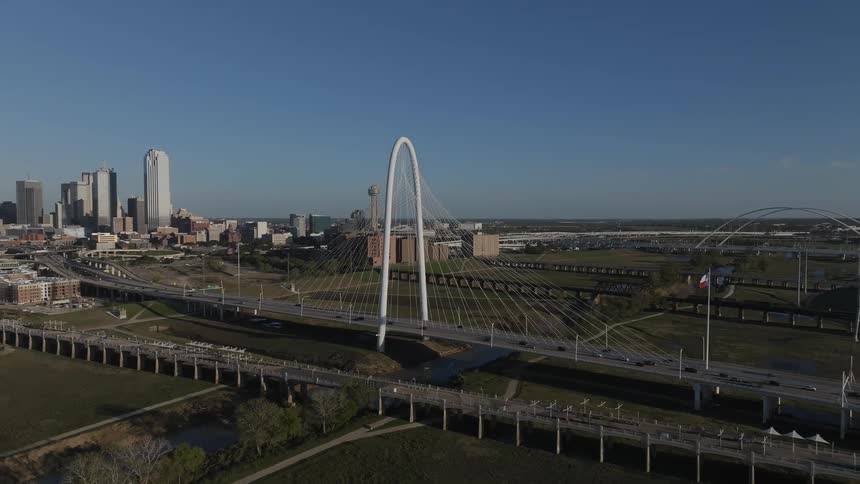 Panorama of an arched bridge with skyscrapers in a metropolis on the horizon