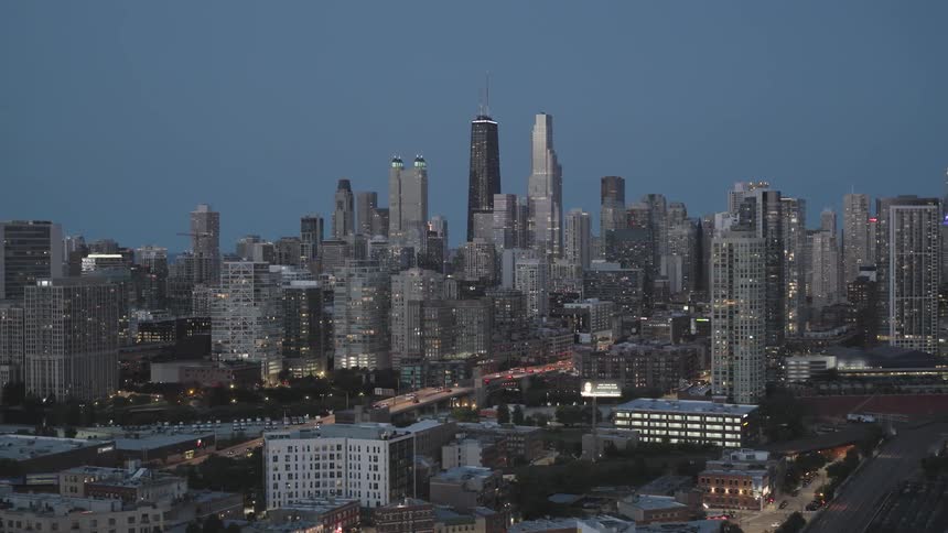 Skyscrapers in a large city at sunset