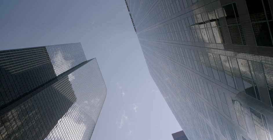 Tall buildings line the sunny sky of this city