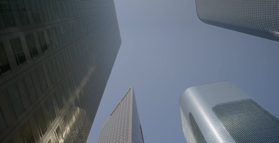 Tall buildings line the clear sky