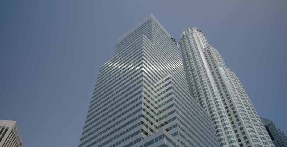 The sun is reflecting off tall buildings