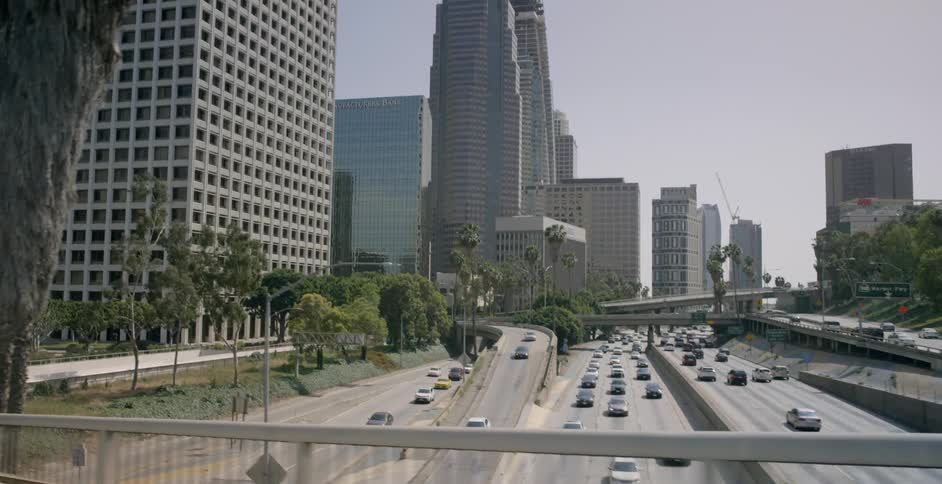 Cars travel on the highway near this city