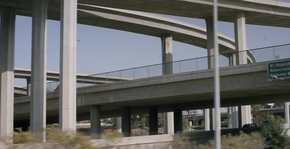 Overpasses line a clear sky above