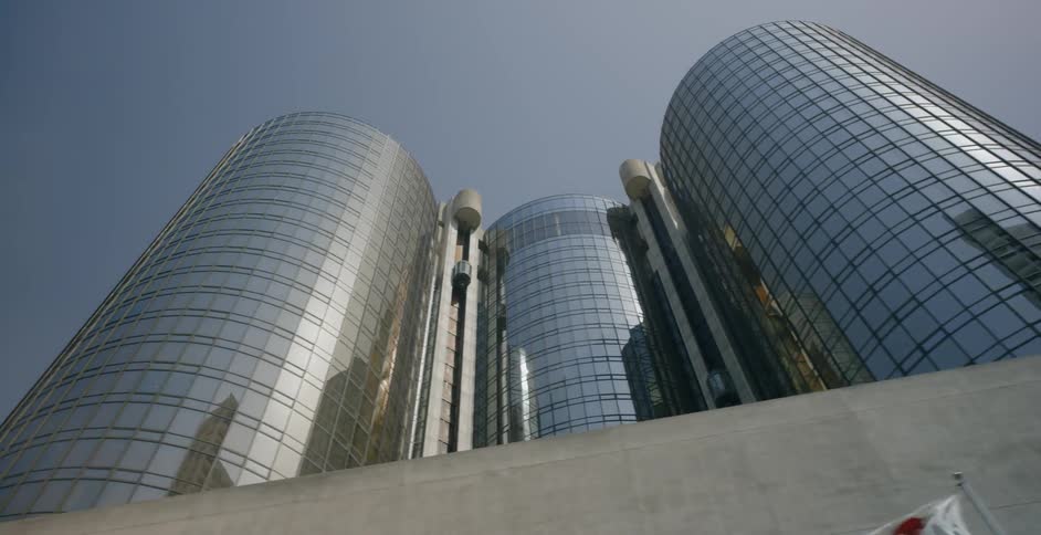 The cylinder shapes buildings are covered with reflective windows