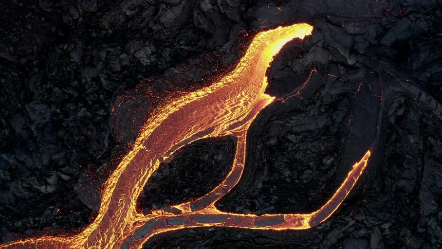 From above an aerial view captures the intense sight of lava flowing