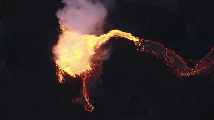 Aerial view of lava flowing from a volcanic eruption