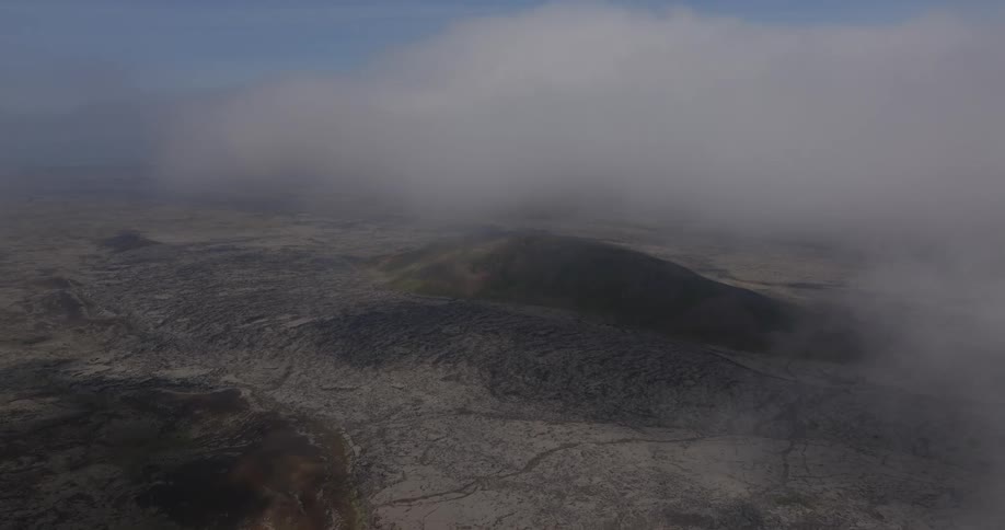 Aerial landscape of a mountain area covered in mist during day time